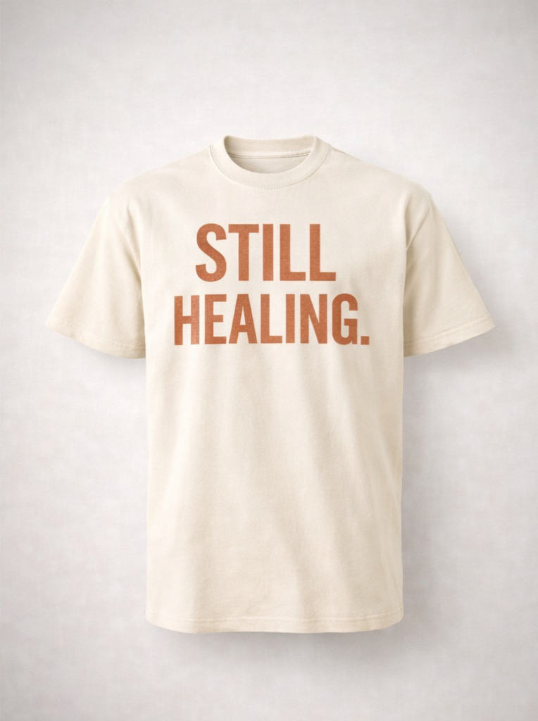 STILL HEALING. STILL LIT.™ T-SHIRT